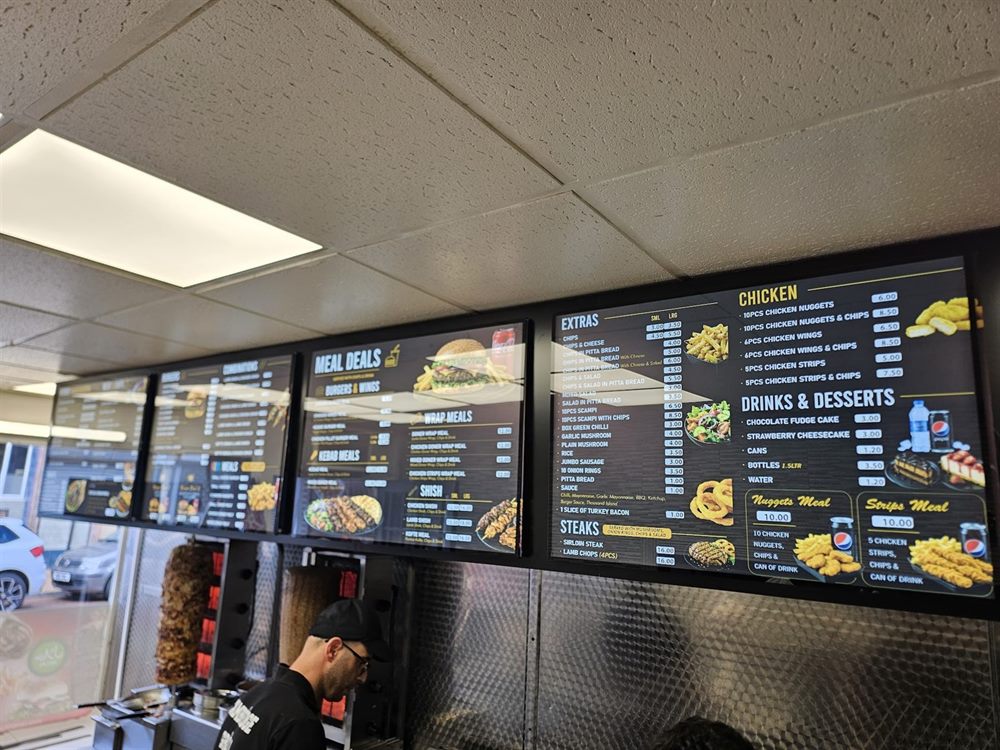 Takeaway menu boards across counter