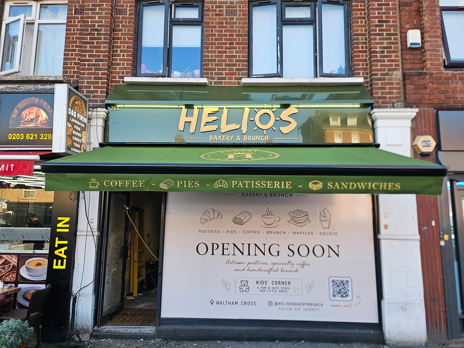 Helios Bakery & Brunch gold fascia lettering, green branded awning and opening-soon window graphics