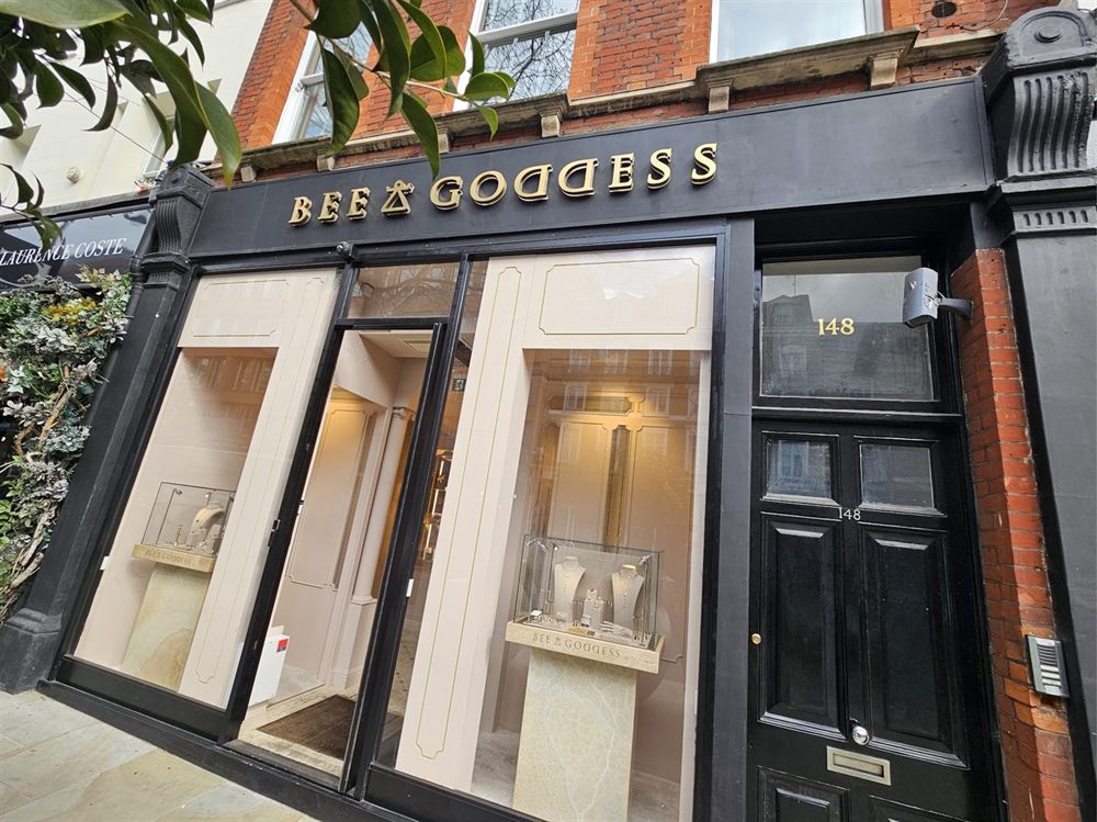 Black and gold shopfront sign