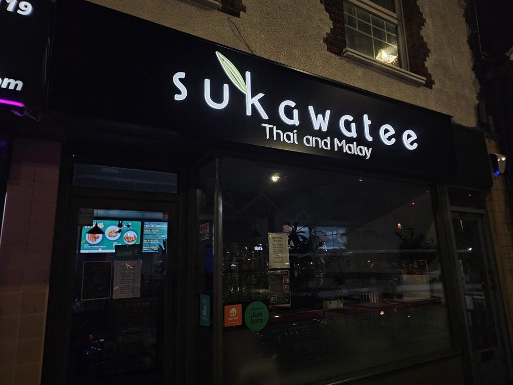 Illuminated Thai restaurant sign