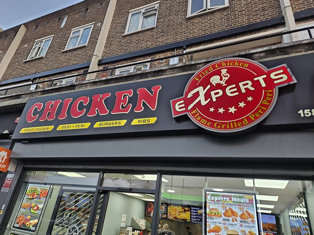 Chicken shopfront sign with projecting logo