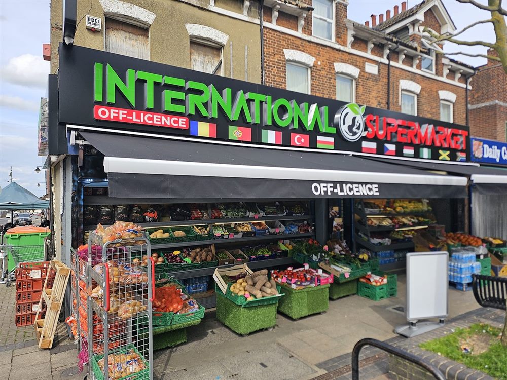 Off-licence shopfront with illuminated fascia