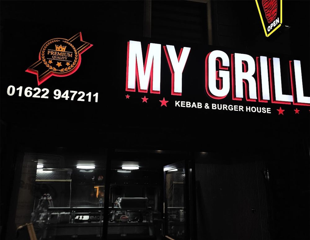 Illuminated grill fascia at night