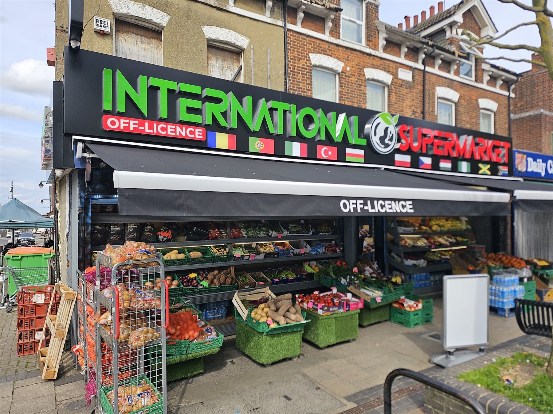 Off-licence shopfront with illuminated fascia signage