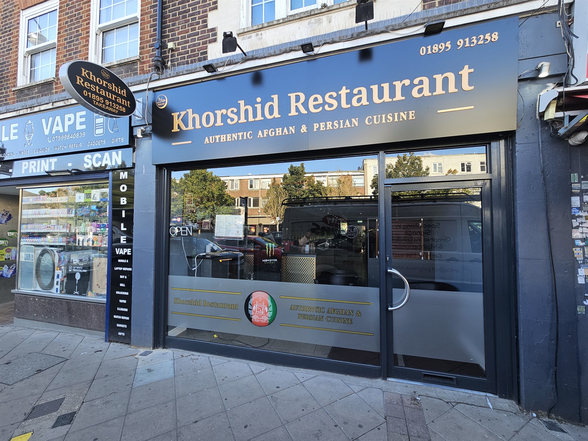 Khorshid Restaurant fascia, projecting sign and window graphics