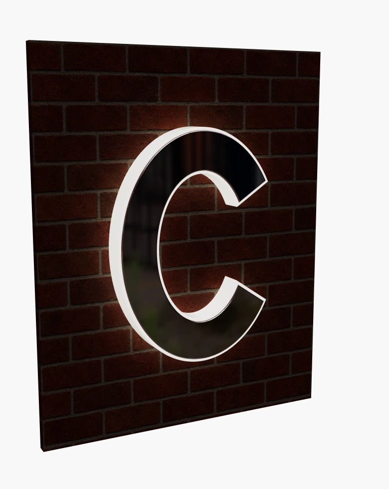 Metal-faced C sign with illuminated edges at night