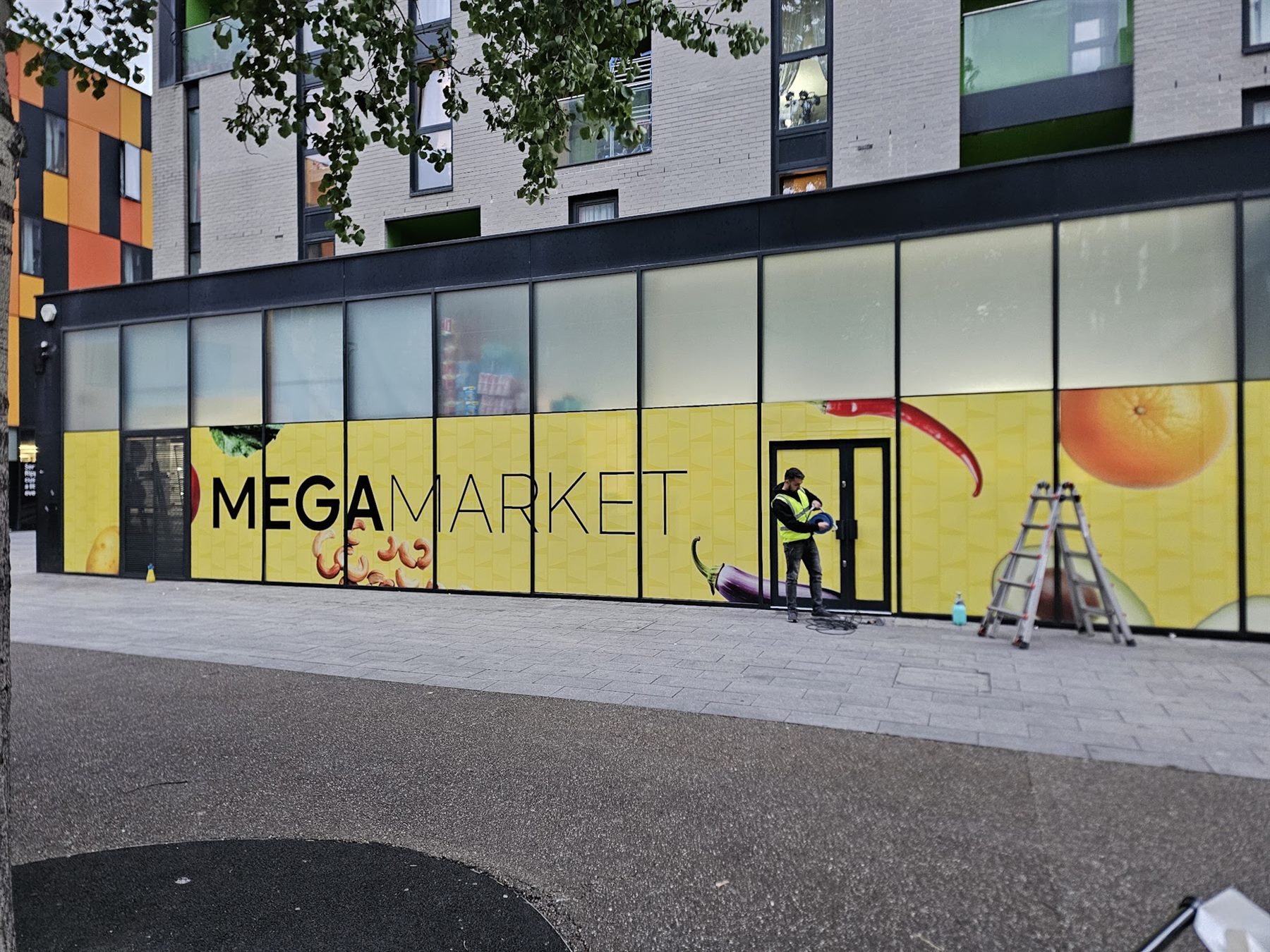 Mega Market full-window shopfront graphics